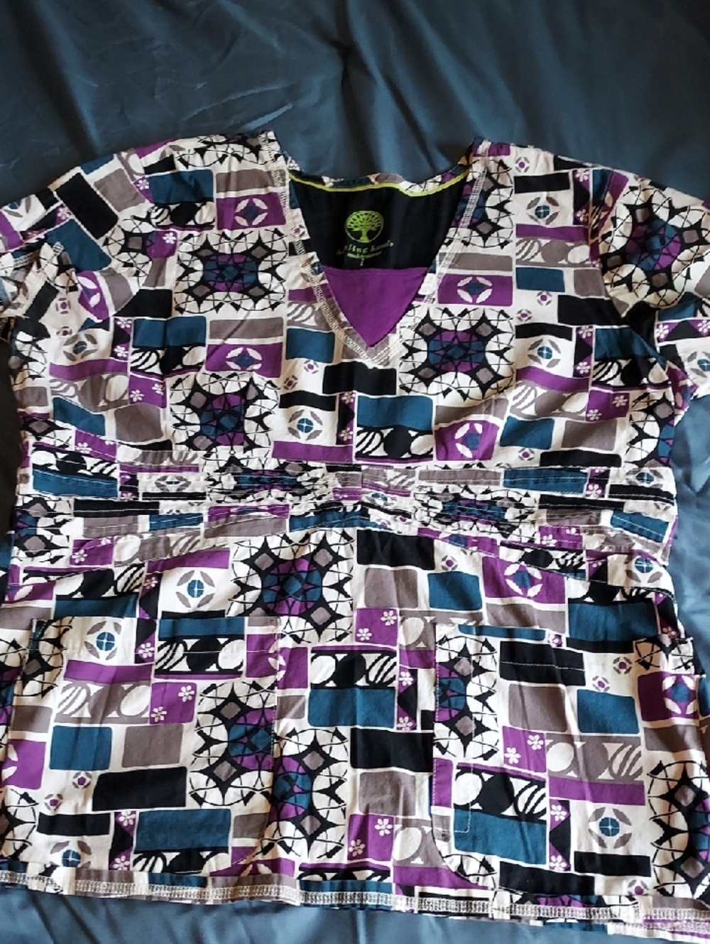 Vibrant Geometric Print Scrub Top in Purple, Teal, Black, Cream